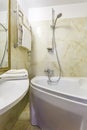 Toilet and detail of a corner shower cabin with wall mount shower attachment Ã¯Â¿Â½Ã¯Â¿Â½ bathroom of hotel Royalty Free Stock Photo